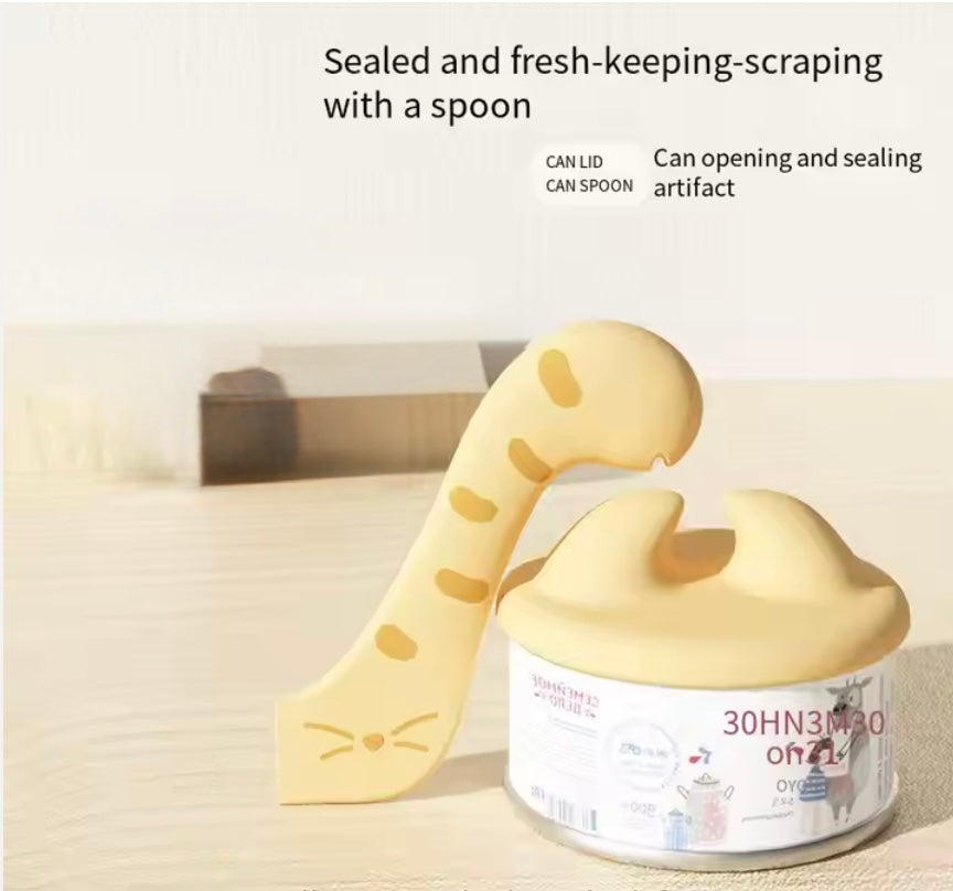 Airtight silicone lid sealing a cat food can with the multi-purpose scraping spoon