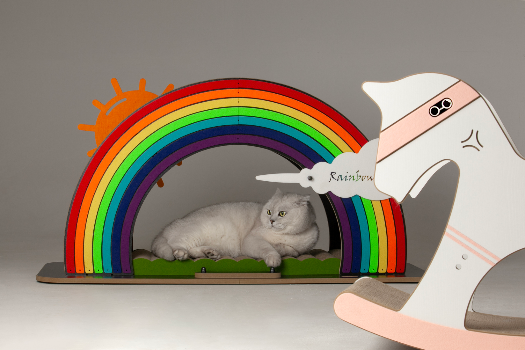 White cat peeking out from the shelter of the large arched Rainbow Bridge tunnel.