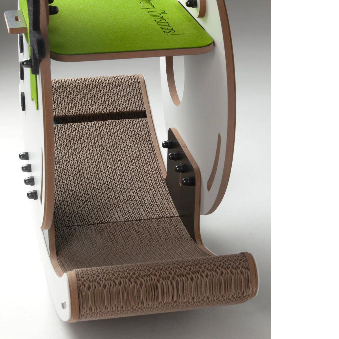 Side view looking down at the high-density corrugated cardboard scratching surface of the Nekono cat rocker.