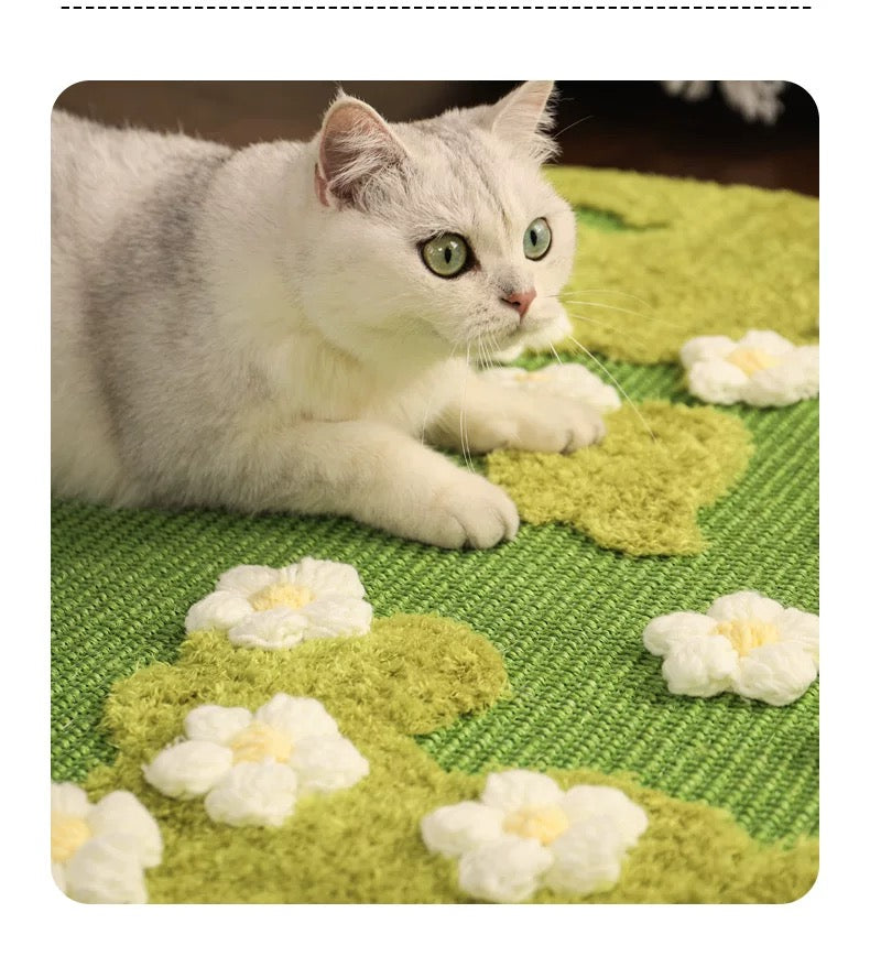 A white cat lounging on the green Spring Meadow sisal mat, showing the 80cm jumbo size suitable for large breeds and multi-cat households.