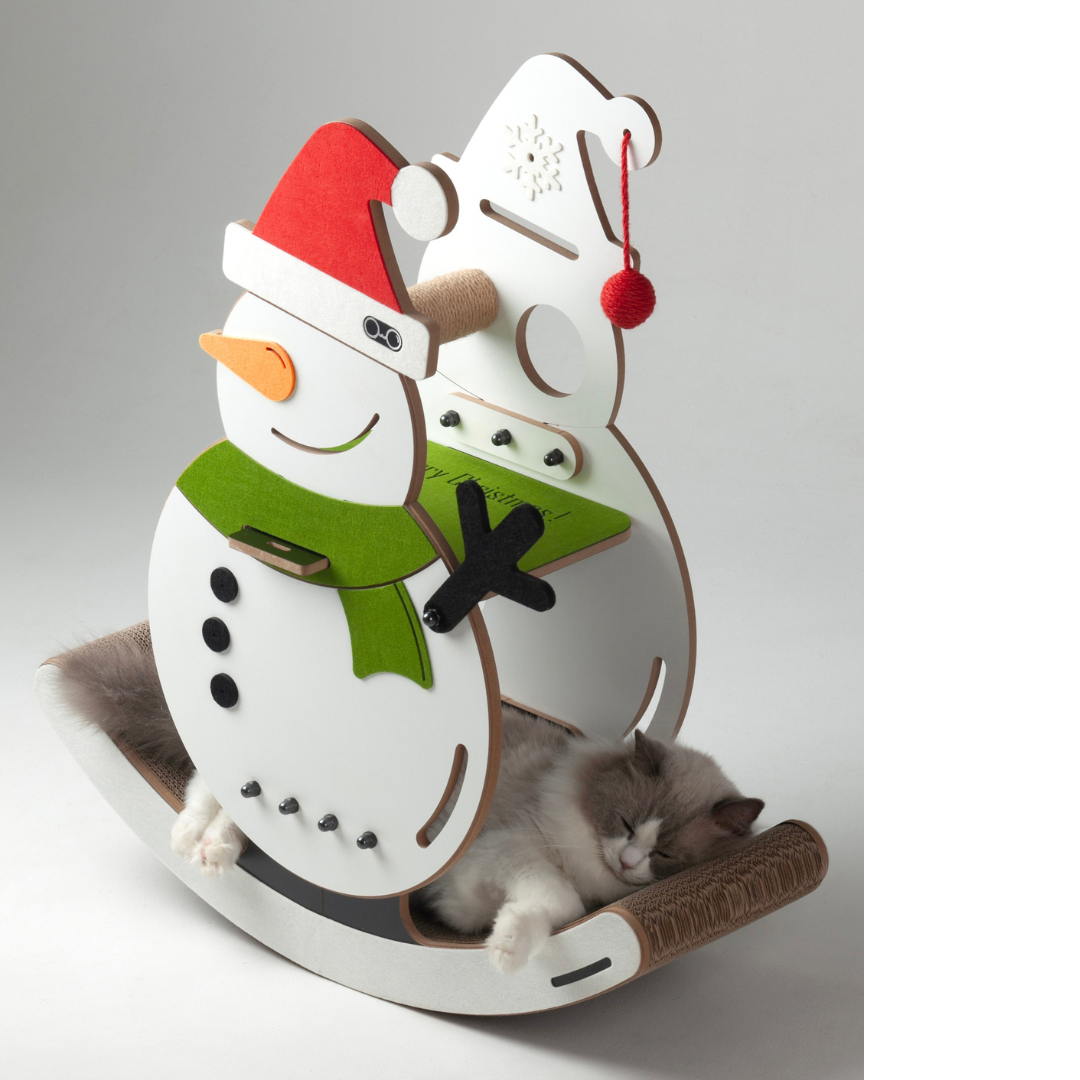Angled view of the snowman cat rocking chair showing a long-haired cat nestled comfortably inside the holiday decor furniture.