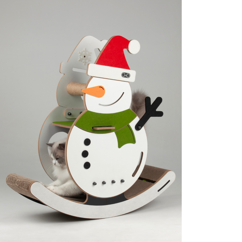 Front view of the Nekono swinging snowman cat scratcher with a cat sitting comfortably inside the holiday-themed frame.