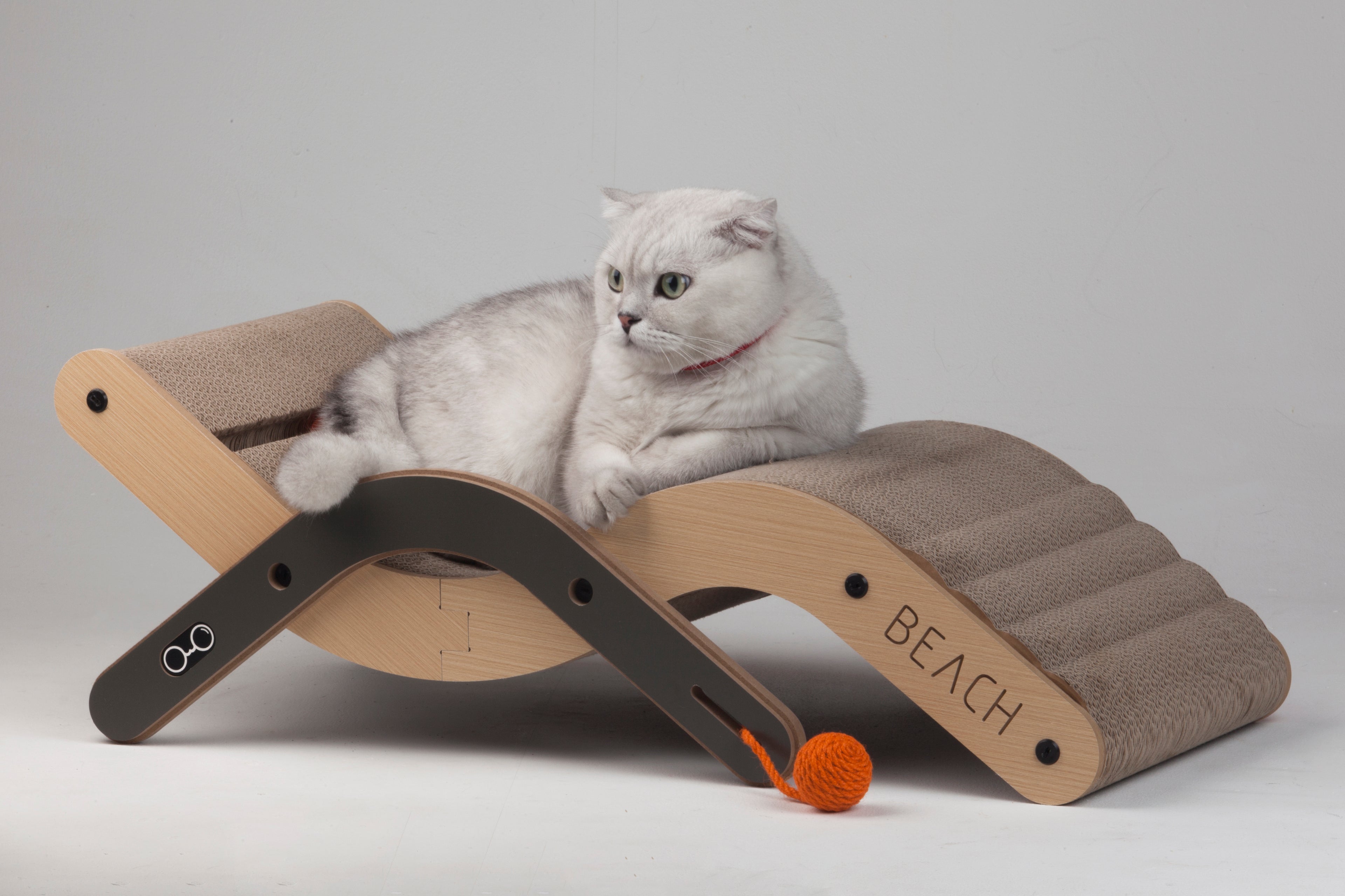 Full view of the Large Nekono Beach Chair Cat Scratcher in a studio setting, perfect for modern home decor.