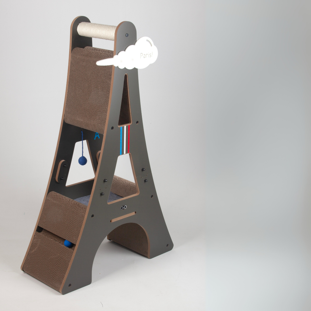 Full side-angled view of the grey Eiffel Tower cat furniture, showcasing all levels and hanging interactive toys.