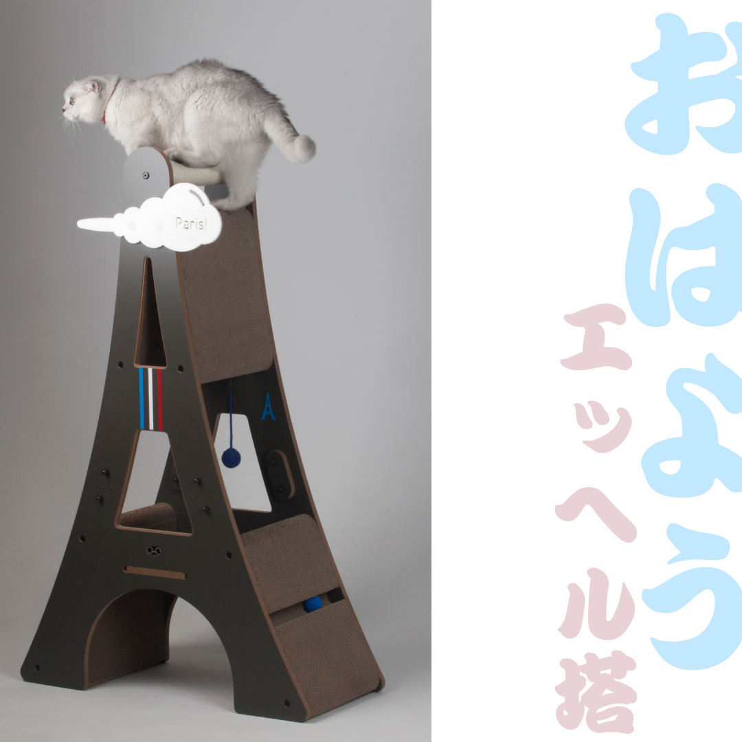 Cat exploring the top level of the Eiffel Tower cat tree, featuring a Japanese aesthetic graphic overlay.