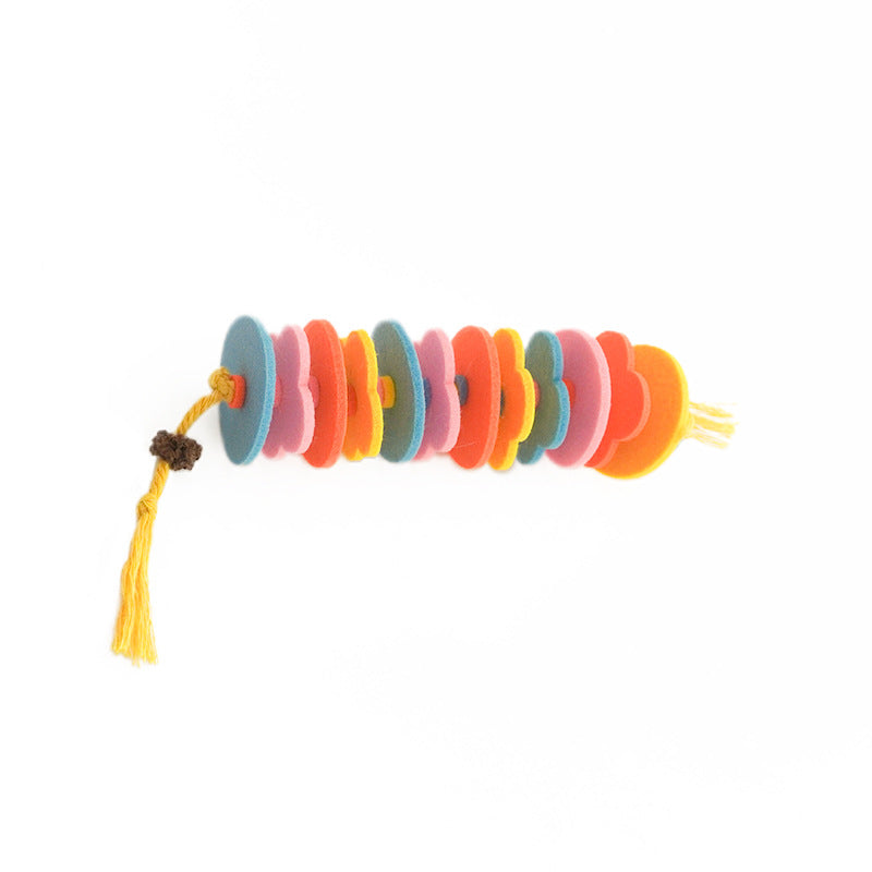 Side view of the handcrafted R.U.S.H. wool felt cat toy with stacked rainbow felt discs