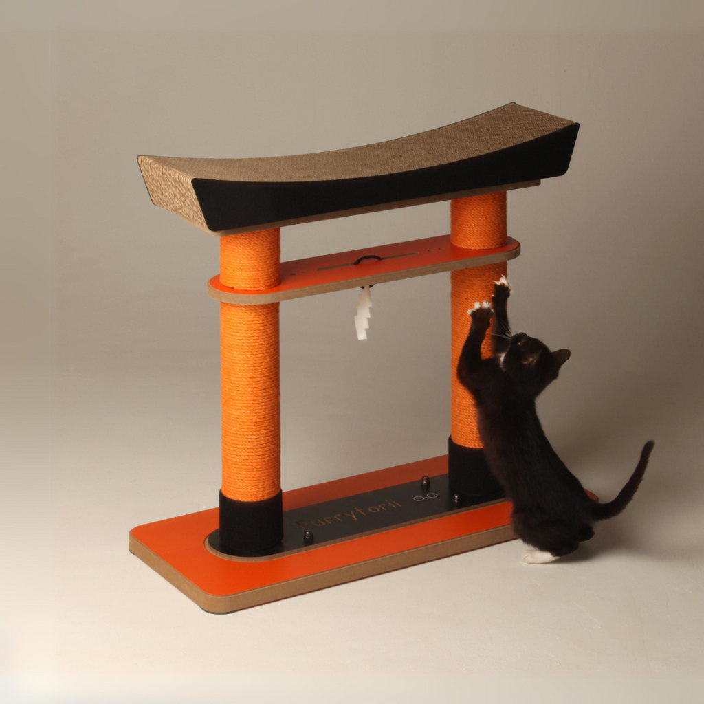 Angled view of a black cat stretching to scratch the tall jute posts of the oriental style cat tree